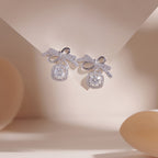 ELVORIA Bow Moissanite Stud Earrings 5mm – Platinum Plated 925 Sterling Silver (GRA Certified)