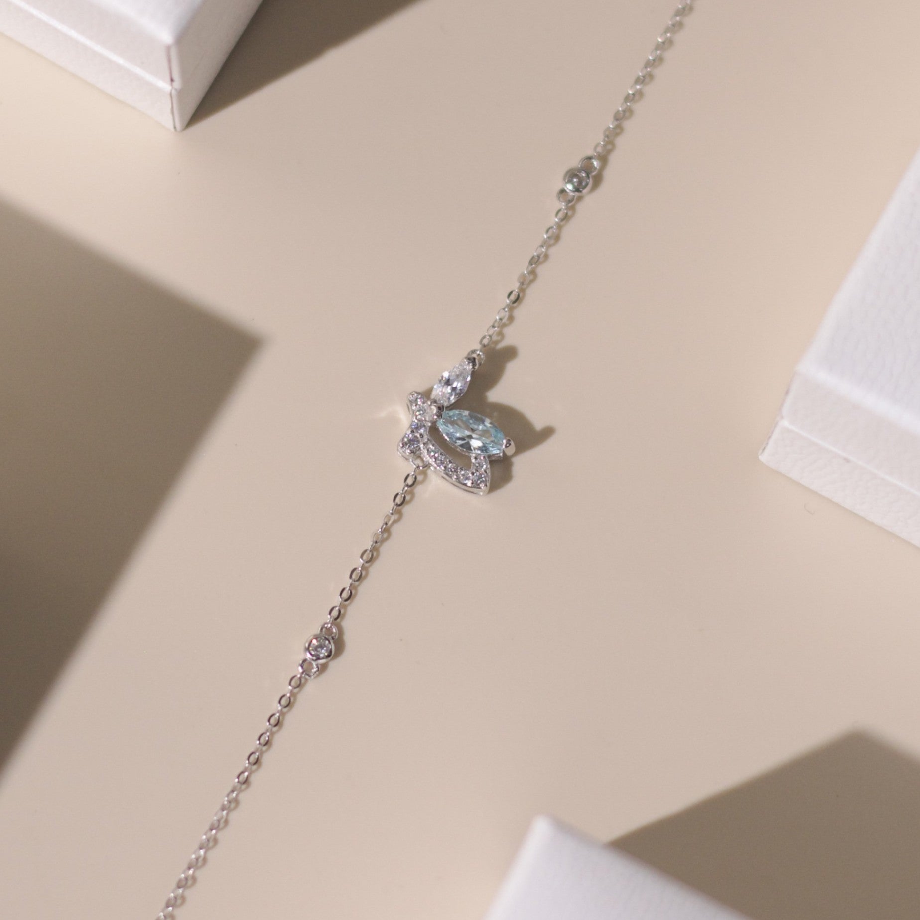 ELVORIA Emmi Butterfly Bracelet with Blue Stone – Platinum Plated 925 Sterling Silver